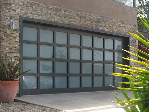 Close-up of a garage door being repaired to ensure smooth operation near me.